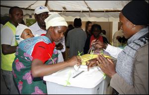 Women get ready to cast their ballots to cast their votes in Kibera's Slums, Nairobi, Kenya.