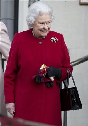 Britain's Queen Elizabeth II leaves the King Edward VII hospital  in London following a one-day stay caused by a stomach ailment.