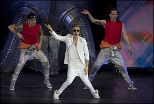 Canadian singer Justin Bieber performs at the O2 Arena in east London, Monday.