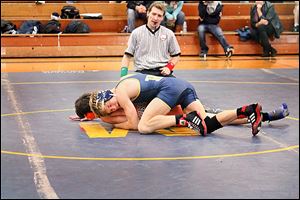 Erie Mason’s Logan Griffin controls a match during the regular season. He missed part of the season because of a shoulder injury but finished 27-0. 