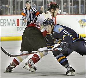 Walleye forward Trevor Parkes, right, on Tuesday was named the ECHL player of the week. In four games last week, the sec­ond-year pro tallied six goals and five as­sists.