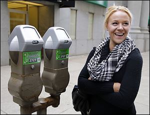 Starr Chellsea Cutino talks about downtown Toledo parking meters and a new pay-by-phone application. She was not surprised that it carries an additional fee.