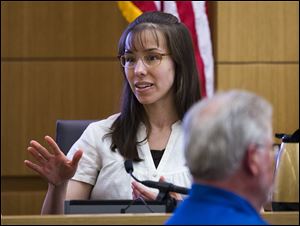 Jodi Arias answers written questions from the jury during her murder trial in Maricopa County Superior Court in Phoenix. Arias is on trial for the 2008 murder of Travis Alexander.