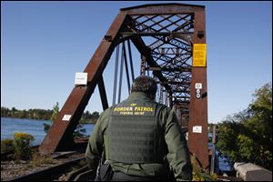 Homeland Security, under which border patrol agents such as this one at the International Railroad Bridge in Buffalo, N.Y., are facing furloughs because of the mandated federal budget cuts.