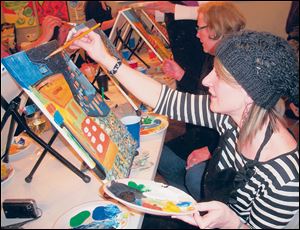 Cari Freeman works on her replica of a Van Gogh painting.