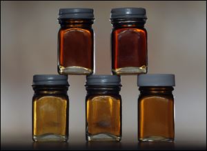 Various grades of maple syrup are displayed. Gov. Rick Snyder has declared March 