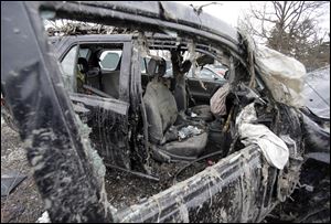 Two teens who escaped the crash that killed six friends in a swampy pond wriggled out of the wreckage by smashing a rear window and swimming away from the SUV, a state trooper said Monday. 
