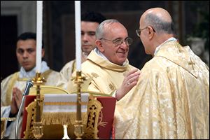 Pope Francis greets Cardinal Tarcisio Bertone, the Vatican secretary of state, right, as the Pontiff presides over his inaugural Mass in the Sistine Chapel in the Vatican. Pope Francis warned the cardinals not to get comfortable with power.