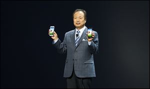 JK Shin, President and Head of IT and Mobile Communications for Samsung Electronics, presents the new Samsung Galaxy S 4 during the Samsung Unpacked event at Radio City Music Hall, Thursday, March 14, 2013 in New York. 