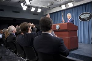 Defense Secretary Chuck Hagel tells reporters that U.S. will add 14 interceptors to a West Coast-based U.S.-based missile defense system reflecting concern about North Korea.