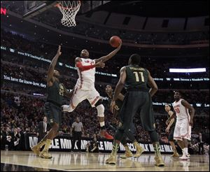 Ohio State's Deshaun Thomas goes up for a shot against Michigan State today at the United Center in Chicago.