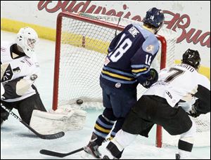 Toledo's Randy Rowe scores on Nailers' goalie Scott Darling in the first period. The Walleye couldn't hold on to a 2-0 lead, letting two crucial points slip by as seeding for the playoffs gets closer and closer.
