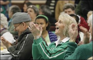 Mary Pierce applauds the entertainment at the festival. The Hibernians order was formed to fight persecution in the United States and elsewhere.