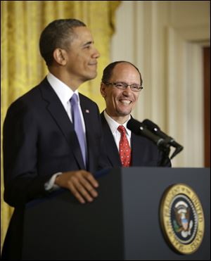 Thomas E. Perez smiles at right as President Obama announces he will nominate Perez for Labor Secretary. 