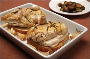 Chicken with garlic and roasted brussels sprouts.