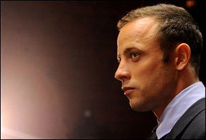 FILE - In this photo taken Friday, Feb. 22, 2013 Olympic athlete, Oscar Pistorius, in court in Pretoria, South Africa, for his bail hearing charged with the shooting death of his girlfriend, Reeva Steenkamp. A lawyer for Pistorius says his appeal against bail conditions will be heard on Thursday March 28, 2013, a day after the culpable homicide trial of older brother Carl begins in another South Africa court.  (AP Photo/Themba Hadebe, File)