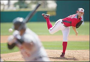 Washington Nationals pitcher Stephen Strasburg delivers a pitch to Detroit's Brayan Pena during the second inning. Strasburg pitched well after being hit by a Prince Fielder line drive.