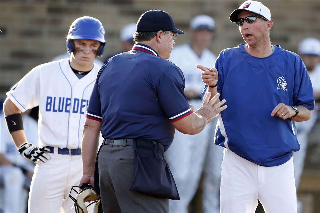 Springfield-head-coach-Dave-Whitmire-argues-a-call-with-an-umpire