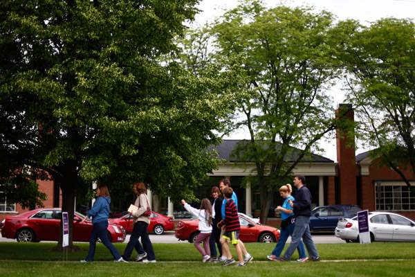 People-walk-along-the-sidewalk
