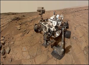 This photo released by NASA shows a self-portrait taken by the NASA rover Curiosity in Gale Crater on Mars.