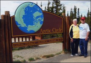 Marge Brown, former mayor of Oregon, and Lenny Fetterman, pose at the Arctic Circle during one of their trips to visit every county in the United States. 