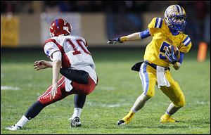 Northwood's Jacob Davenport looks to get past Patrick Henry's Gabe Jones in a playoff game last season. Davenport caught 21 passes for 365 yards and nine touchdowns in 2012.