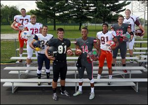 From left, are Southview's Ryan Stout, Patrick Henry's Colt Pettit, Whitmer's Marcus Elliot, Perrysburg's Nate Patterson, Central Catholic's DeShone Kizer, Southview's Nate hall, Central Catholic's Zach Harmon, and Genoa's Michael Deiter.