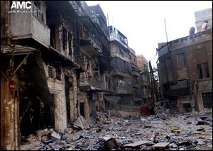 Tthis citizen journalism image provided by Aleppo Media Center AMC on Friday, which has been authenticated based on its contents and other AP reporting, shows damaged residential buildings from heavy fighting between Free Syrian army fighters and government forces in Aleppo, Syria.