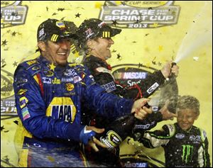 NASCAR Chase drivers Martin Truex Jr., left, and Kurt Busch, right, celebrate their making the Chase on Sunday after the NASCAR Sprint Cup Series auto race at Richmond International Raceway in Richmond, Va.