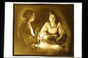 George De La Tour's 'The New Born' lithophane is one of the works in the collection of the Blair Museum of Lithophanes at Toledo Botanical Garden.