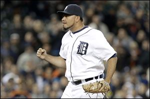 Detroit's Joaquin Benoit celebrates the final out Monday night against the Seattle to earn his 21st save in 21 chances this season. Rick Porcello got the win to improve to 13-8.