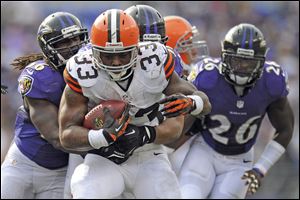 Cleveland Browns running back Trent Richardson carries the ball during an NFL football game against the Baltimore Ravens in Baltimore. The Browns have traded Richardson to the Indianapolis Colts in a surprise move less than two years after drafting him in the first round. ]