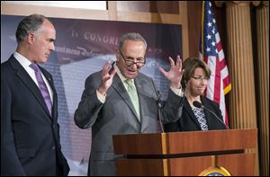 Sen. Chuck Schumer, D-N.Y., chairman of the Rules Committee, center, flanked by Sen. Robert Casey, D-Pa., left, chairman of the Subcommittee on Fiscal Responsibility and Economic Growth, and Sen. Amy Klobuchar, D-Minn., right, Senate chair of The Joint Economic Committee, speaks to reporters about the economic consequences of a debt ceiling default, during a news conference at the Capitol, Wednesday, Sept. 18, 2013. House GOP leaders Wednesday announced that they will move quickly to raise the government's borrowing cap by attaching a wish list of GOP priorities like blocking Obamacare, forcing construction of the Keystone XL pipeline and setting the stage for reforming the loophole-cluttered tax code. (AP Photo/J. Scott Applewhite)