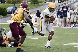 UT running back Damion Jones-Moore runs for a 15-yard score during the fourth quarter of Saturday’s 38-17 victory against Central Michigan in Mount Pleasant, Mich. The redshirt freshman has scored two touchdowns in as many weeks for the Rockets.