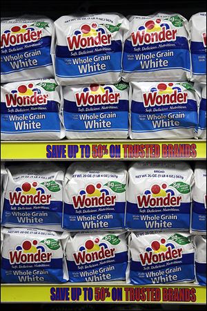 Wonder Bread — a familiar presence on store shelves for decades until last November — began returning to supermarkets on Monday after being bought by Flowers Foods from Hostess Brands.