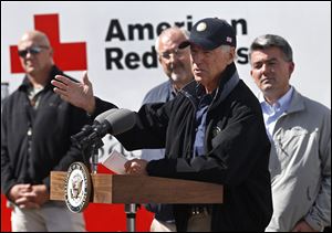 Vice President Joseph Biden speaks to members of the media at a FEMA Disaster Recovery Center Monday, joined by Rep. Cory Gardner, (R., Colo.), right, following a day in which Biden surveyed area flood damage by helicopter, in Greeley, Colo.