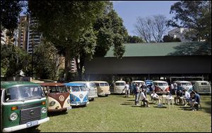 Members of the Sampa Kombi club, a group of Volkswagen van owners, gather for their monthly meeting in Sao Paulo. Brazil is the last place in the world still producing the vehicle.