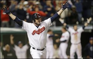 Cleveland Indians' Jason Giambi reacts after hitting a two-RBI home run off Chicago White Sox relief pitcher Addison Reed in the ninth inning.