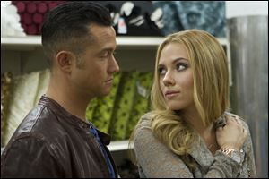 This film image released by Relativity Media shows Joseph Gordon-Levitt, left, and Scarlett Johansson in a scene from 