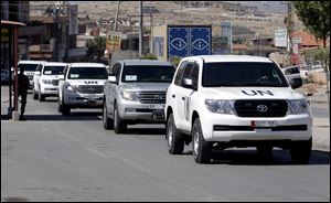 A convoy of inspectors from the Organization for the Prohibition of Chemical Weapons prepares to cross into Syria at the Lebanese border crossing point of Masnaa, eastern Bekaa Valley, Lebanon.