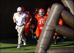 Bowling Green State University head coach Dave Clawson, left, said he feels UMass is better than its 0-4 overall record suggests. BG beat the Minutemen 24-0 last season.