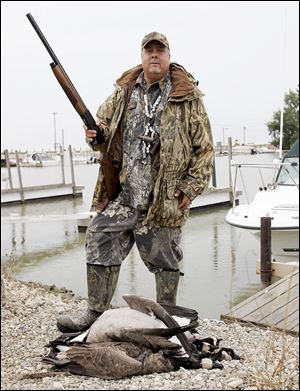 Toledo outdoorsman Mike McCroskey displays geese he shot during the early goose season in September. He has been guiding hunts for more than 30 years.