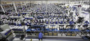 Employees work at the Motorola smartphone plant in Fort Worth, Texas. The plant is the only U.S. factory making mobile phones.