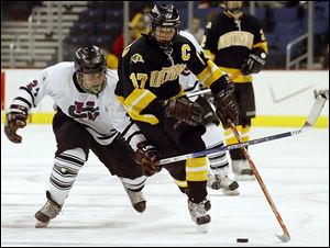 Northview's Alden Hirschfeld, right, skates past University School's Yule Baron in 2006. The Wildcats won the state semifinal but fell in the championship.
