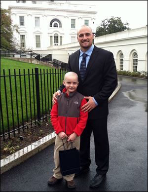 Jack stands with former Nebraska football player Rex Burkhead after meeting with President Barack Obama on April 29 in Washington