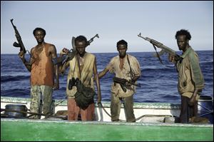 From left, Faysal Ahmed, Barkhad Abdi, Barkhad Abdirahman, and Mahat Ali in a scene from the movie.