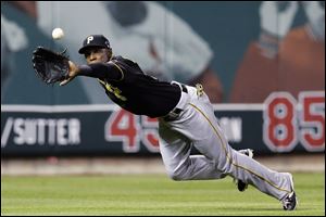 Pittsburgh Pirates left fielder Starling Marte makes a diving catch on a ball hit by St. Louis Cardinals' Matt Carpenter in the third inning.