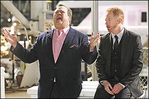 Eric Stonestreet, left, and Jesse Tyler Ferguson play a gay couple in the ABC television series ‘Modern Family.’