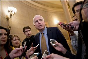 Sen. John McCain (R., Ariz.) talks to reporters on Capitol Hill last week upon his return from a two-hour meeting at the White House between President Obama and Republican senators.