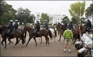 U.S. Park Police move past the front of the White House on Pennsylvania Avenue on  Sunday, where war veterans and Tea Party groups were protesting the partial government shutdown now entering its third week.